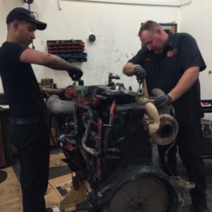 Dennis and Richard Tearing Down Diesel Engine Core