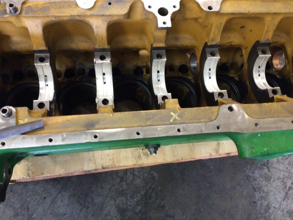 Laying Crankshaft in John Deere 4045 Engine